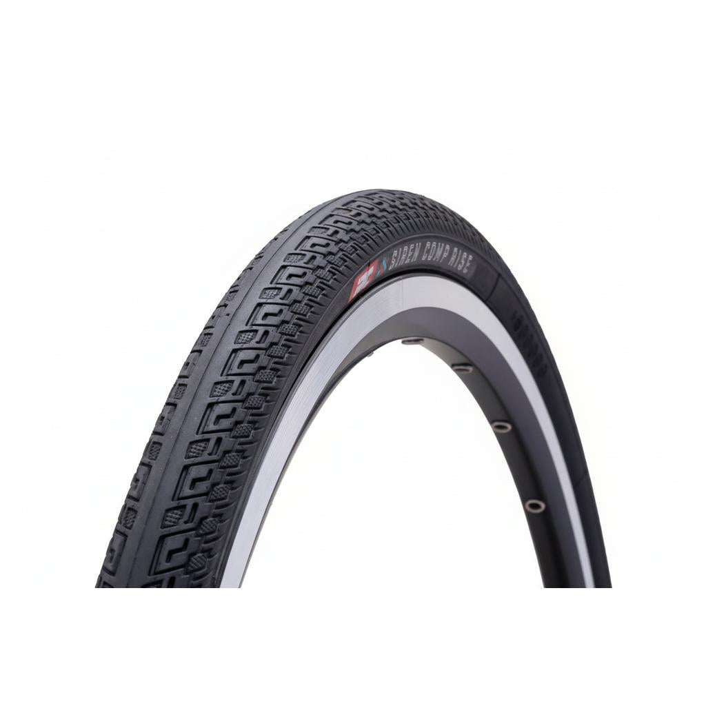 A close-up of the IRC Siren Comp Rise 20 Inch Tyre reveals its black foldable design, textured tread pattern, and distinctive white sidewall against a white background. Lightweight and built for track performance, this tyre offers cyclists an ideal balance of quality and value at an affordable price.