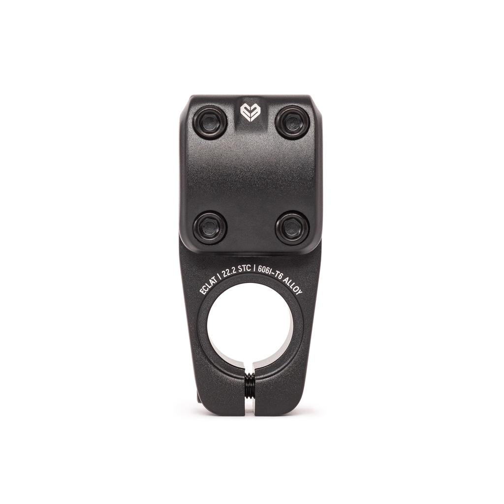 The Eclat Onyx Stem (22.2mm Clamp) is a black BMX stem with four faceplate bolt holes, a circular base clamp, and white engraved lower text. Features Shark Tooth Clamping for enhanced grip.