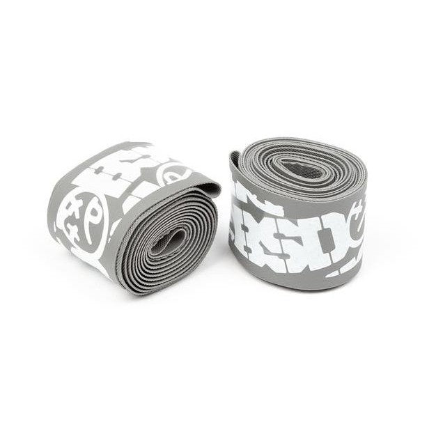 A pair of BSD Rim Strips in grey and white featuring tough tapes, set against a white background.