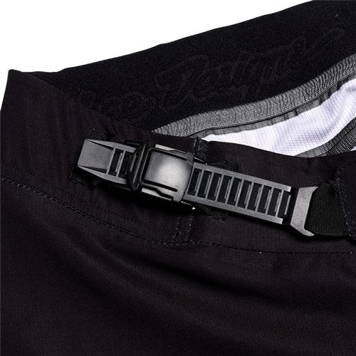 Close-up of the TLD 26.1 Sprint Ultra Pant / Mono Black, featuring a black adjustable waistband with a plastic ratchet buckle for a precision fit.