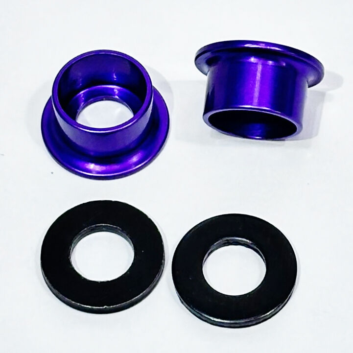 Two Profile Alloy Hub Top Hats with steel washers (pair) are displayed on a white background: two purple metal bushings and two black alloy bike washers.
