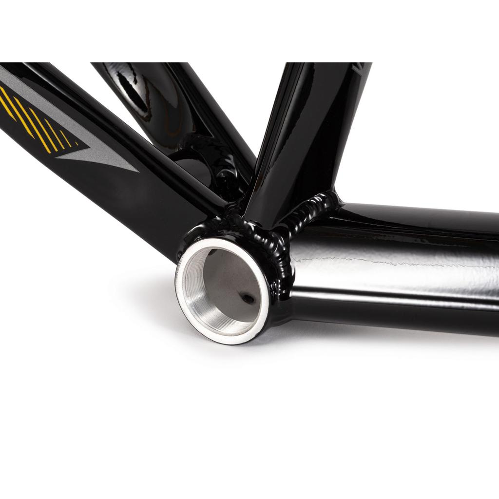 Close-up of the Radio Raceline Helium Cruiser 24 Frame's hydroformed 6061 alloy bottom bracket shell, showing visible welds, a metallic inner surface, and disc brake compatibility.