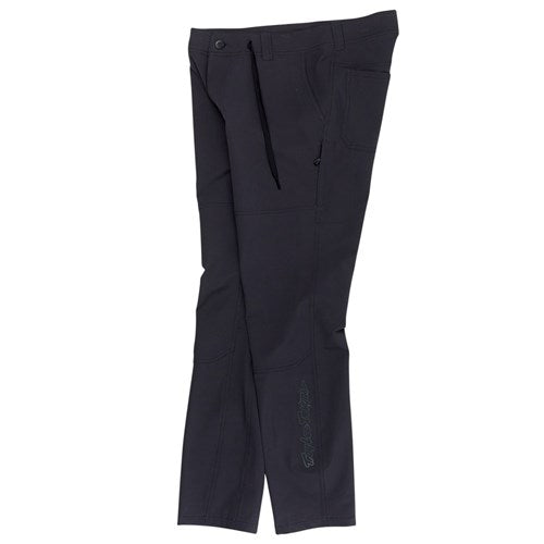A pair of TLD 25.2 Ruckus Long Travel Pants in Mono Carbon, featuring front pockets and a button-drawstring waistband, made from 4-way stretch fabric, displayed on a white background.