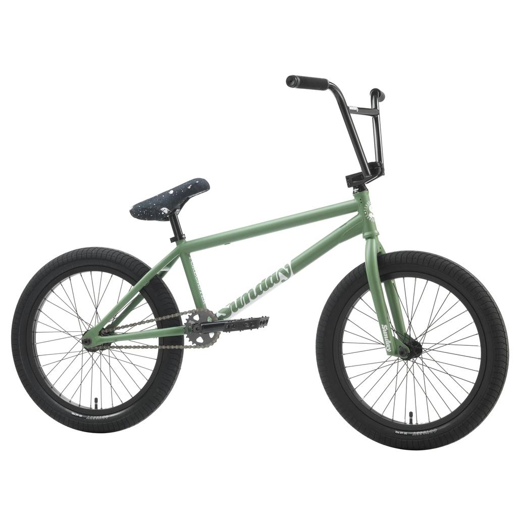 The Sunday Forecaster 20 Inch Bike (2025) / Brett Silva is a green pro-level BMX with a 100% chromoly frame, black tires, black handlebar, and a black seat with white speckles—inspired by the Brett Silva Forecaster design.