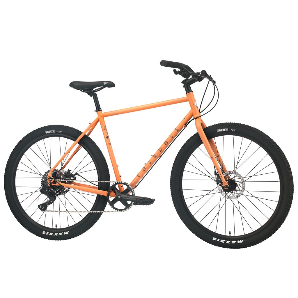 The Fairdale Weekender Archer Bike is an orange all-terrain bicycle with black handlebars, saddle, and tires. It features disc brakes, a single front chainring, and works great as a light-tourer or versatile commuter bike.