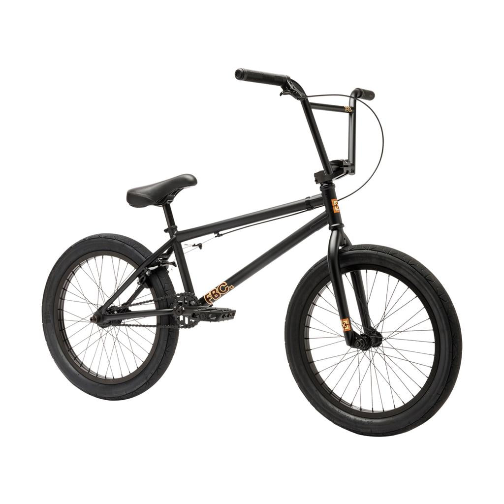 The Fit Bike Co STR 20 Inch Bike (2026) features thick tires, straight handlebars, and orange accents—a black BMX ideal for modern street riding, shown on a white background.