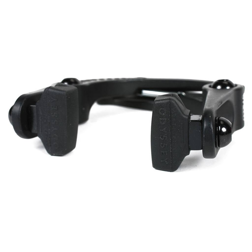 The Odyssey Springfield Brakes feature a black caliper with rubber brake pads, a curved metal arm, and mounting bolts, showcasing Odyssey engineering. Photographed on a white background.