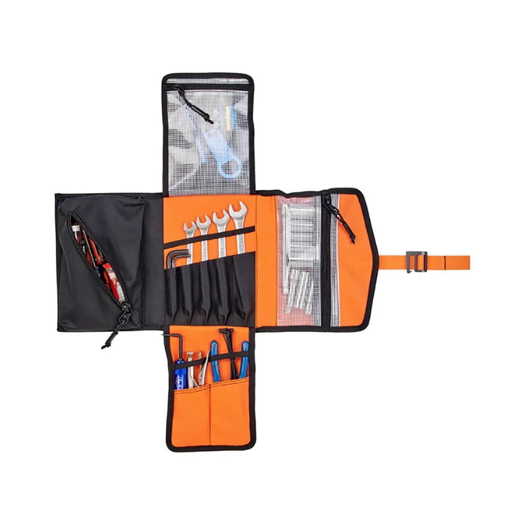 A tool bag with a variety of tools in it, including S&M Biltwell Exfill Tool Roll.