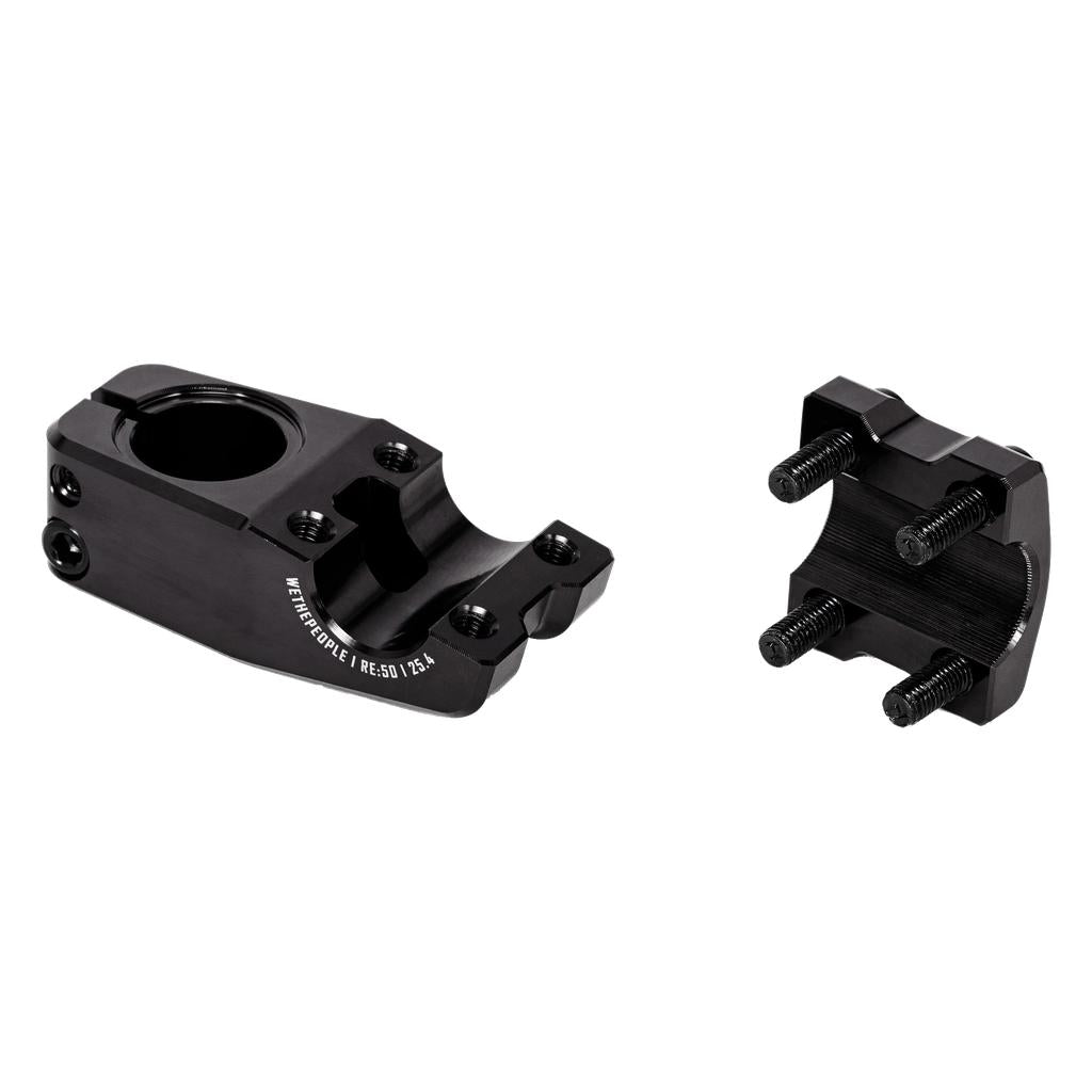 The Wethepeople Logic Oversized Top Load Stem (25.4mm Clamp) in black metal is shown in two separated pieces on a plain white background, featuring four mounting bolts.