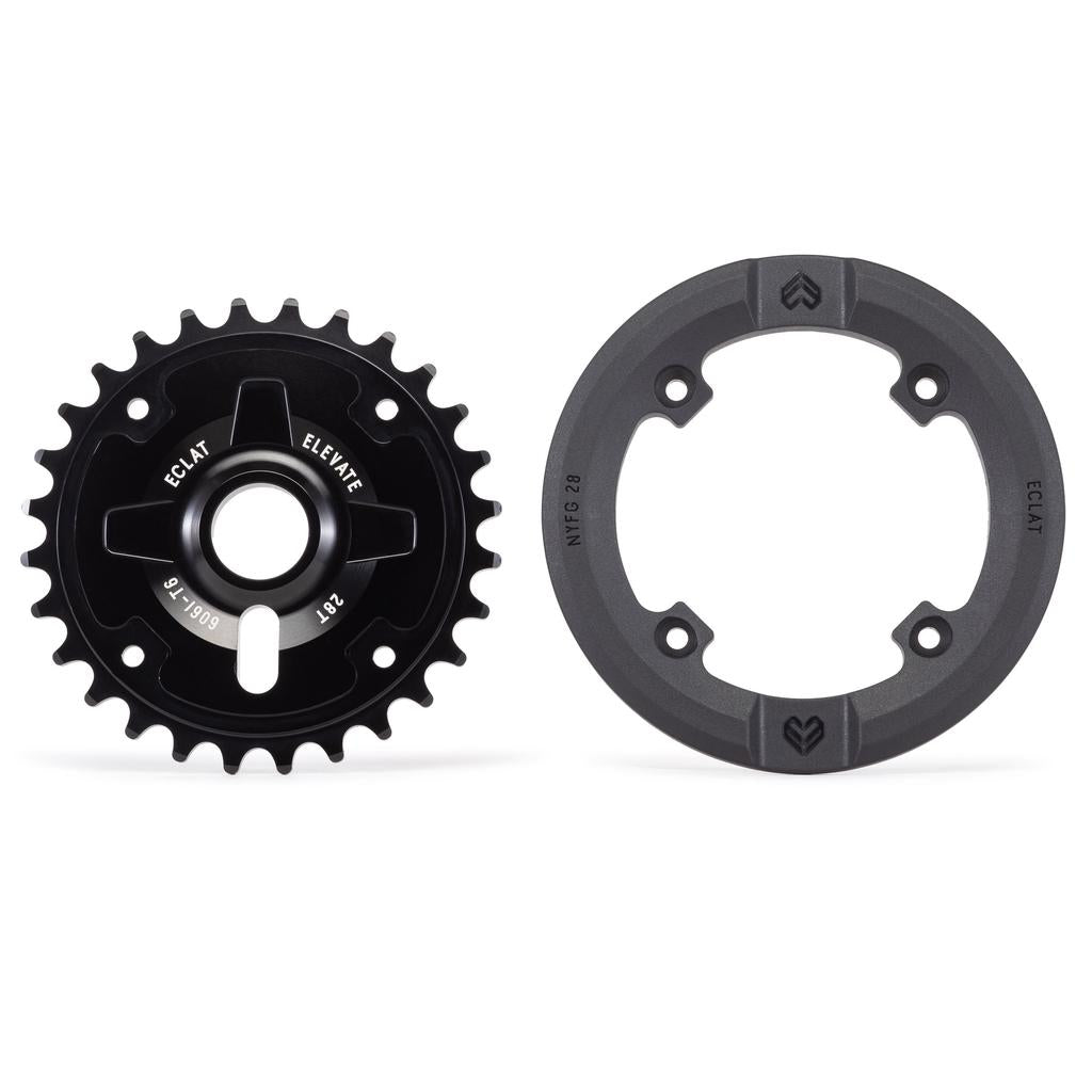 The Eclat Elevate Guard Sprocket in black 6061-T6 alloy is displayed beside a tough black nylon fiberglass guard, both shown on a white background.