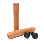 Two tan Cult Solo Grips made from durable rubber with a textured surface and two black end caps are shown standing and lying on a white background—perfect for BMX bikes.