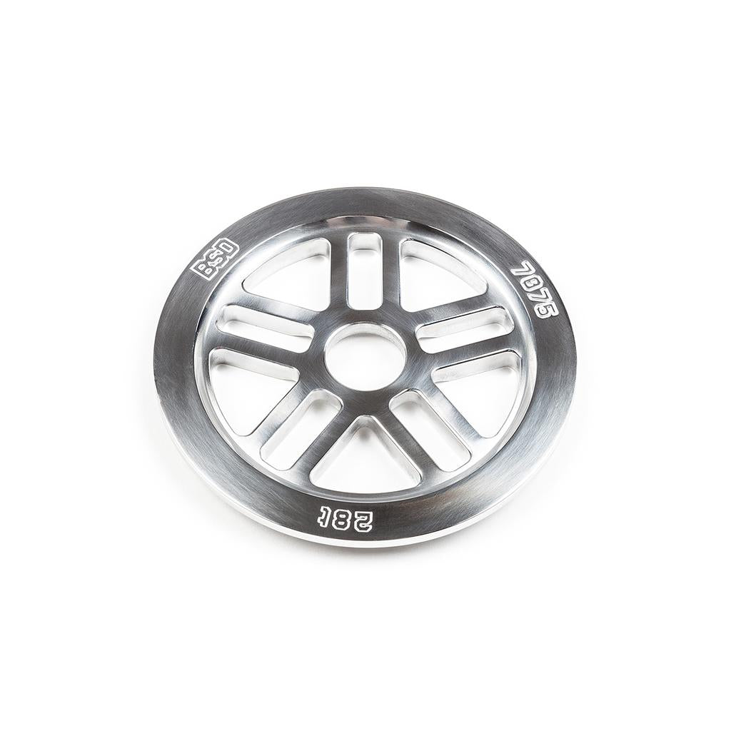 The BSD Guard Sprocket is a silver metal sprocket with six spokes and engraved "BSD," "7075," and "28T" markings, crafted from durable 7075-T6 for reliable performance. It is shown on a white background.