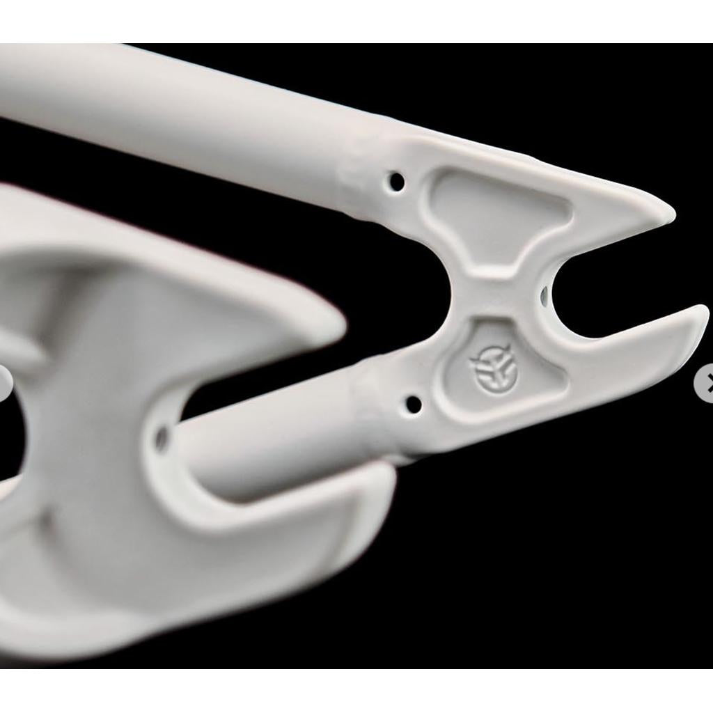 Close-up of a white Federal Boyd V2 Frame (Boyd Hilder Signature) component with two pronged ends, circular openings, and an embossed logo on a black background.