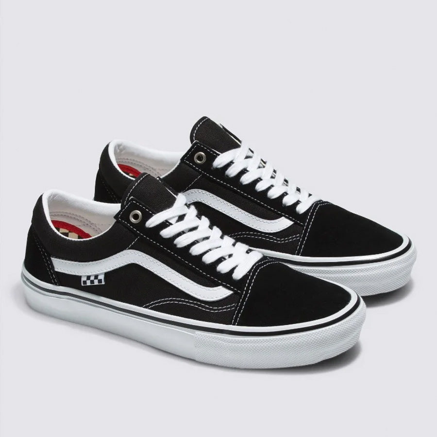 A pair of Vans Skate Old Skool shoes in black and white with white laces and a signature side stripe, displayed on a white background.