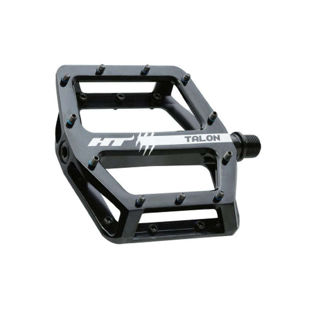 HT AN71 Talon Pedals, featuring black platform design with metal pins and white side branding, shown angled on a white background.