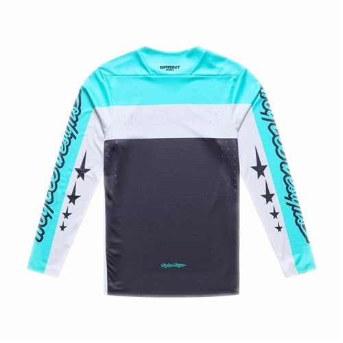 The TLD 26.1 Sprint Pro Jersey / Yo Moto Carbon features turquoise, white, and black colors with star/text sleeve designs, logo accents, and a race fit in Bluesign-approved fabric.