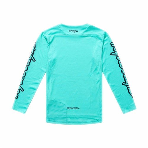 The TLD 26.1 Sprint Pro Jersey (Youth) in Mono Real Teal is a long-sleeve aqua-blue jersey with black sleeve graphics, laid flat on a white background. Made from Bluesign-approved fabrics for comfort and sustainability.