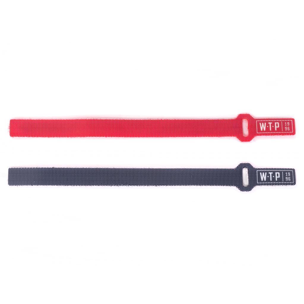 Two Wethepeople Brake Cable Velcro Holders—one red, one black, both labeled “WTP”—are displayed on a white background. Ideal for efficient cable management and easy adjustment.