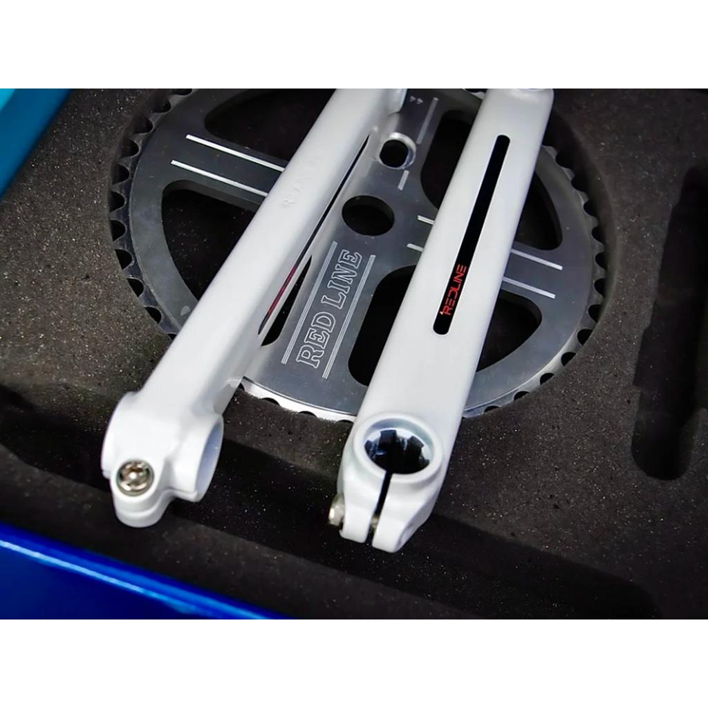 Close-up of a Redline Vintage Flight 401 Crank Set and chainring, made from 4130 chromoly steel, shown in a protective foam case.