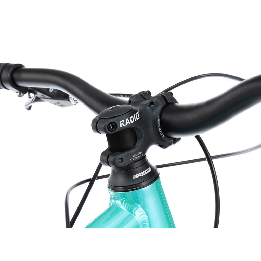 Close-up of the Radio Fiend 26 Inch Bike's handlebar and stem on a turquoise 6061-T6 alloy frame, highlighting brake cables and headset details against a white background.