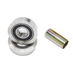Two metal ball bearings are stacked beside a cylindrical spacer—components from the S&M USA Bottom Bracket Set for BMX—displayed on a white background.