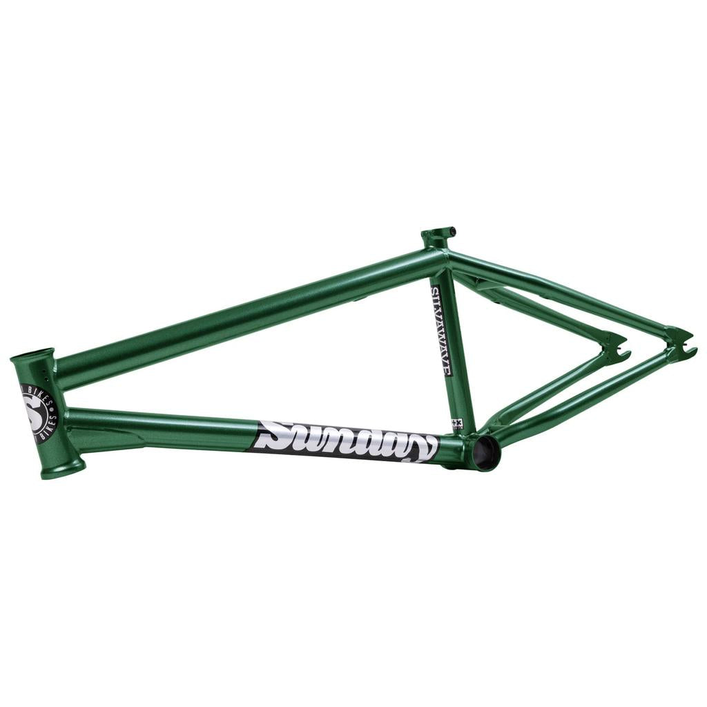The Sunday Silvawave Frame (Brett Silva Signature) is a green BMX frame with a "Sunday" logo on the down tube, made from 100% 4130 chromoly, shown angled to display the head tube, top tube, and rear stays.
