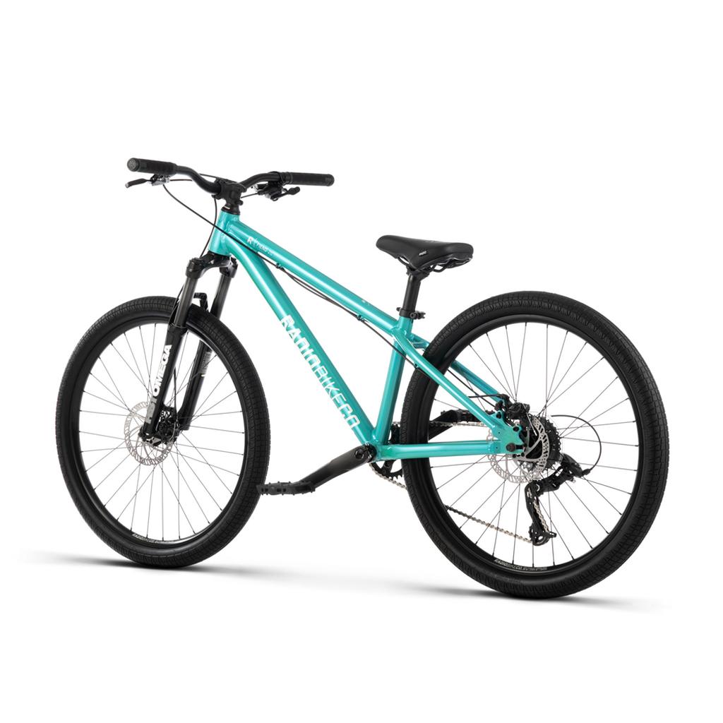 A side view shows the teal Radio Fiend 26 Inch Bike with a 6061-T6 alloy frame, black handlebars, seat, and tires. This dirt jump bike includes front suspension and disc brakes.