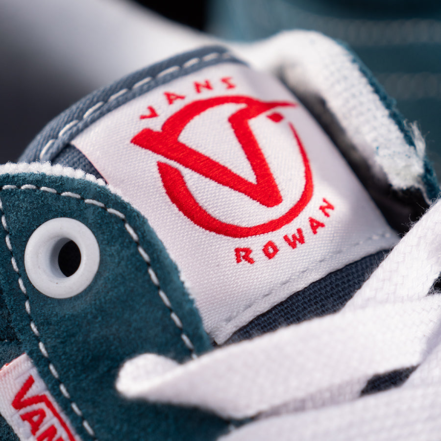 A close up of a Vans Rowan Leather Shoe in Blue with the logo on it.