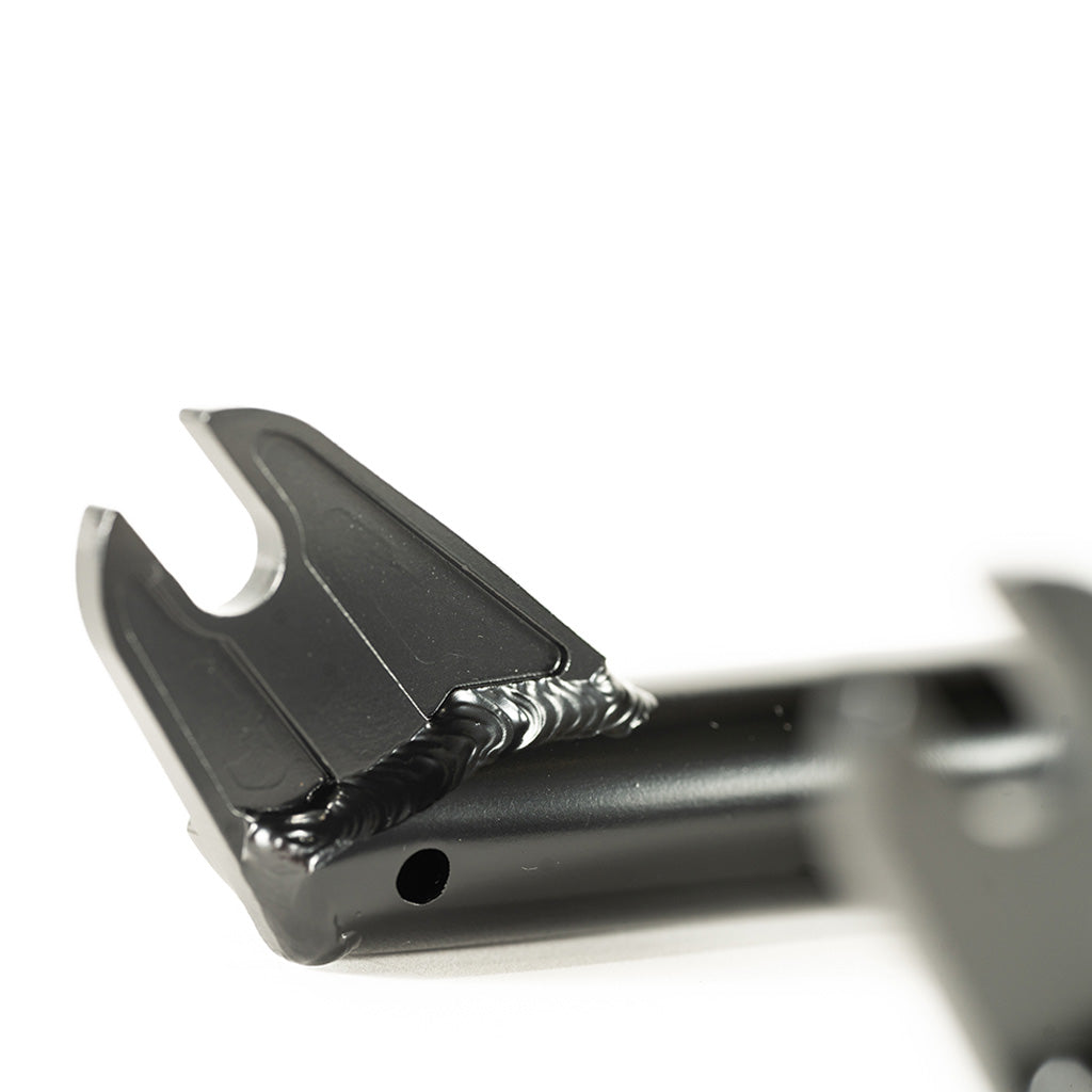 A close up of a black plastic handlebar with Colony 18 Sweet Tooth Fork / Black branding.