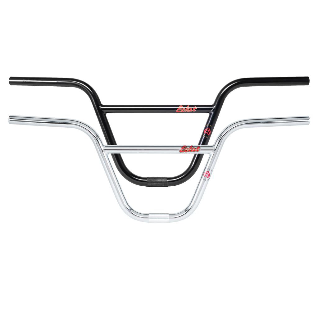 Two BMX handlebars, one black and one chrome, are stacked together against a white background, each featuring a red and white logo near the center. These are the Eclat Chocolate Bars (22.2mm Clamp), known for their durability and rider-focused design.
