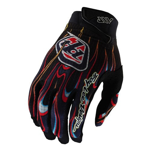 The TLD Air Glove Torched Black / Red features bold red, orange, and blue flame graphics, making it perfect for mountain bike enthusiasts. The iconic Troy Lee Designs logo appears prominently on the back.
