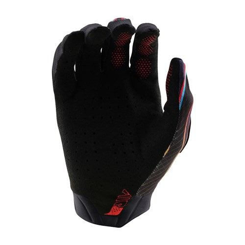 The TLD Air Glove Torched Black / Red is a full-finger glove with red and blue accents, shown upright with the palm facing away, perforated for breathability—ideal for mountain bike enthusiasts seeking style and comfort.