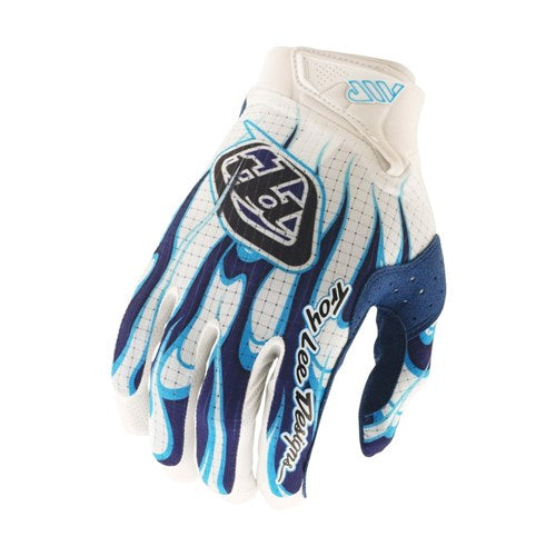 The TLD Air Glove Torched White / Blue features blue and black accents, flame-like finger patterns, and the Troy Lee Designs logo—premium cycling gloves that deliver both style and performance.