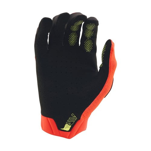 The TLD Air Glove Stripes Infra Red / Black features a black and red design with yellow grip dots on the fingers, shown with the palm facing down.