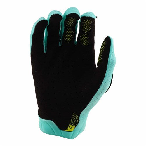 The TLD Air Glove / Mono Real Teal features a black and teal design with yellow accents, displayed with the palm facing out and fingers slightly curved—perfect mountain bike gloves for both style and comfort.