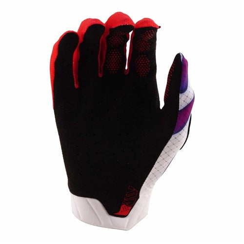 The TLD 26.1 Air Gloves (Youth) in Overspray White feature a black, red, white, and purple design with a textured palm and perforated surface, shown upright against a white background.