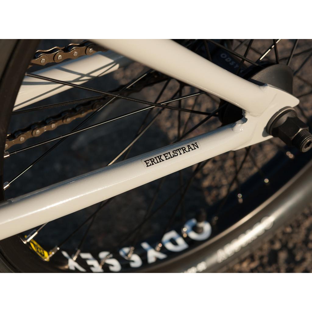 Close-up of the Sunday EX Erik Elstran 20 Inch Bike, featuring a 100% chromoly frame with "ERIK ELSTRAN" and "ODYSSEY" branding, plus Odyssey Springfield Brakes visible near the rear wheel.