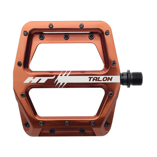 HT AN71 Talon Pedals with an orange alloy body, black replaceable grip pins, and white branding are displayed on a plain white background.