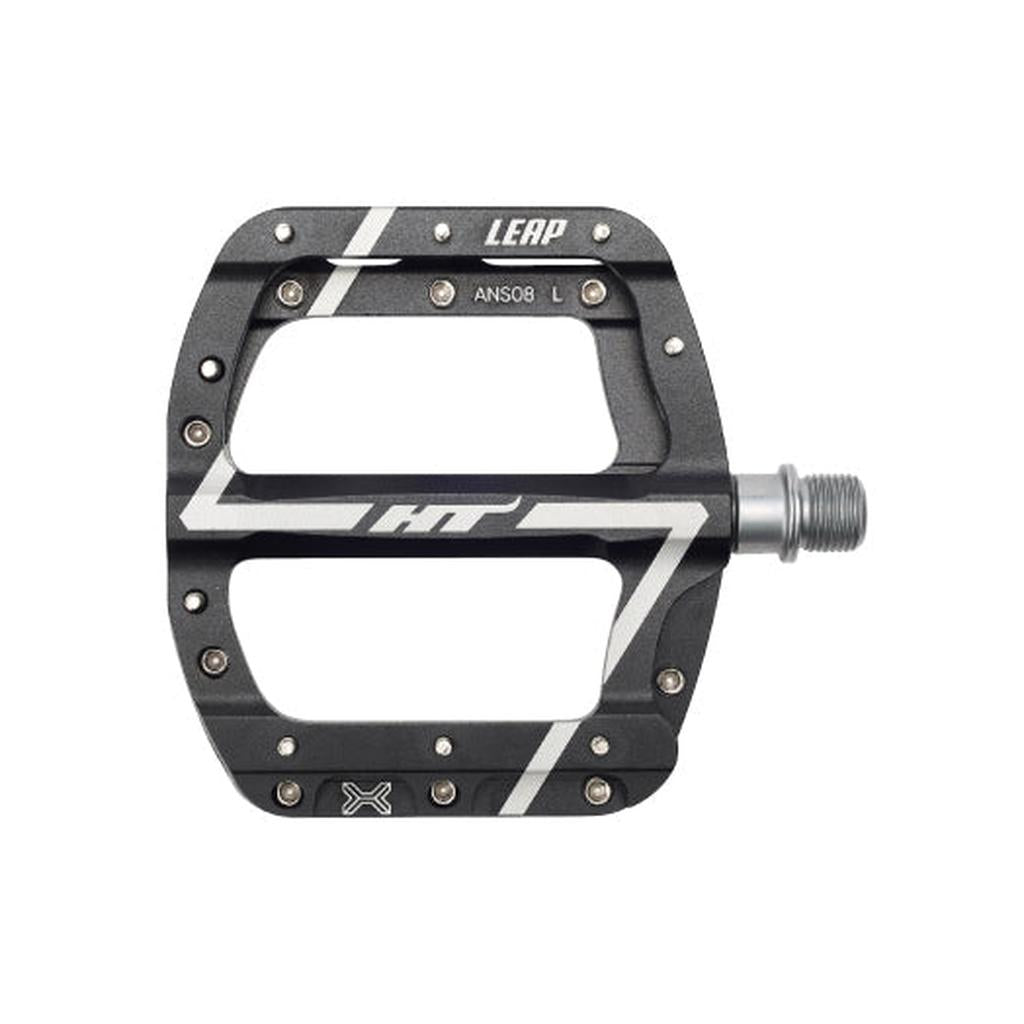 The HT Components Leap ANS08 Pedals are black and silver flat mountain bike pedals marked "LEAP" and "HT," with metal pins, a durable axle, and a reliable EVO+ bearing system.