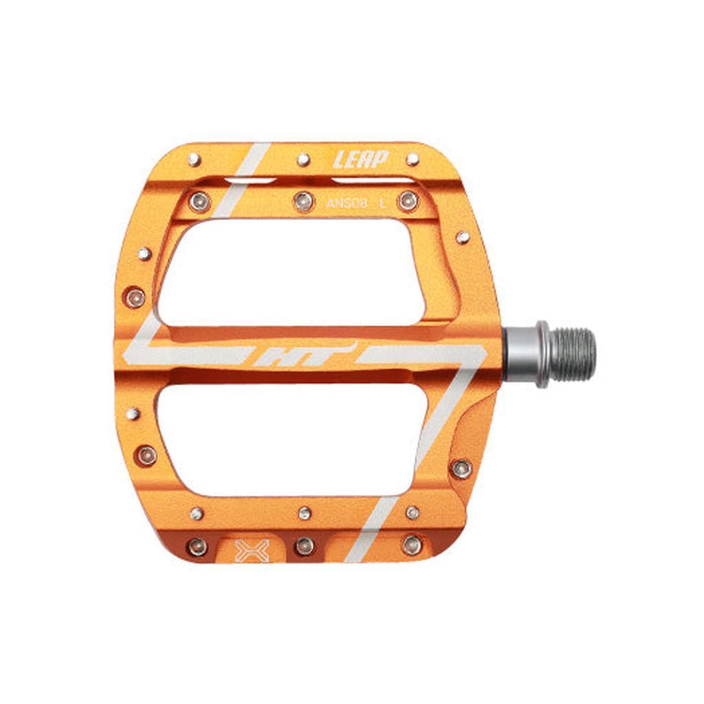 Orange flat HT Components Leap ANS08 mountain bike pedal with silver axle, white branding accents, multiple grip pins, and a durable EVO+ bearing system, shown from above for smooth cycling performance.