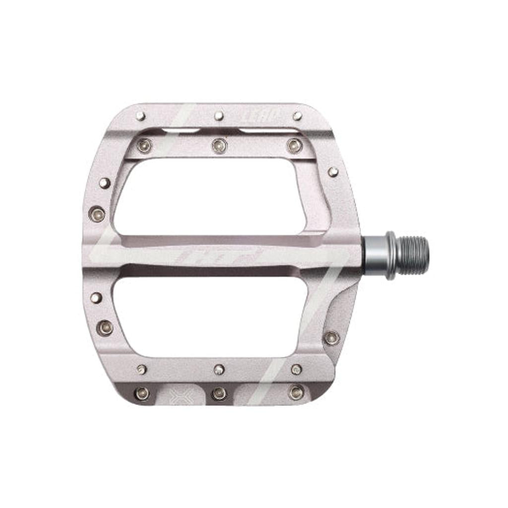 The HT Components Leap ANS08 Pedals are flat, silver aluminum pedals with multiple grip pins and a threaded spindle, perfect for mountain bike use.