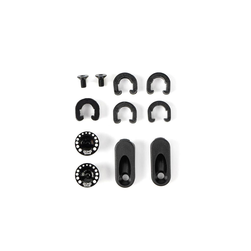 A set of black hardware—screws, clips, circular and oblong parts with holes—on a white background, designed for the Radio Raceline Quartz 2025 Pro XL Cruiser Frame with a sliding dropout disc system for BMX race bikes.