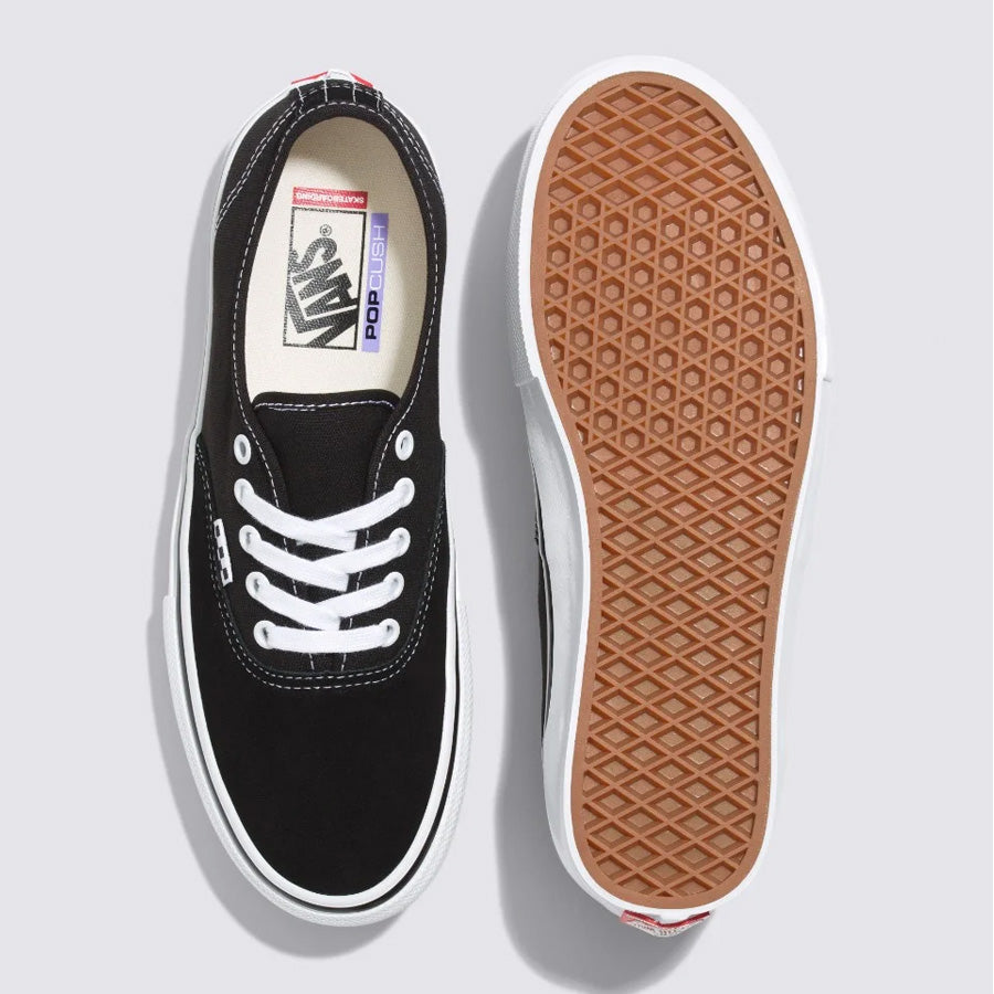 A pair of Vans Pro Skate Classics Authentic - Black/White sneakers with white soles from the Vans Skate Pro Series.