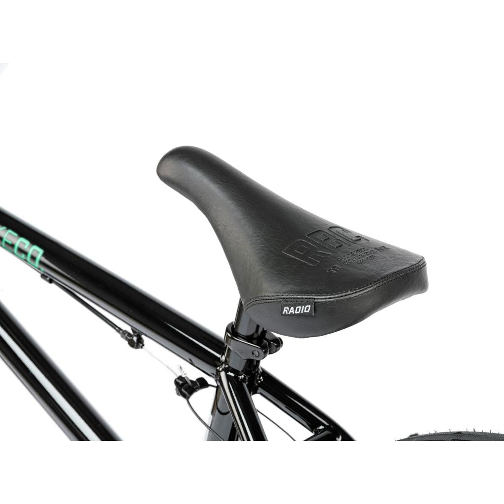 Close-up of a black seat labeled "RADIO" on the frame of the Radio Saiko 18 Inch Kids BMX Bike, shown against a white background.