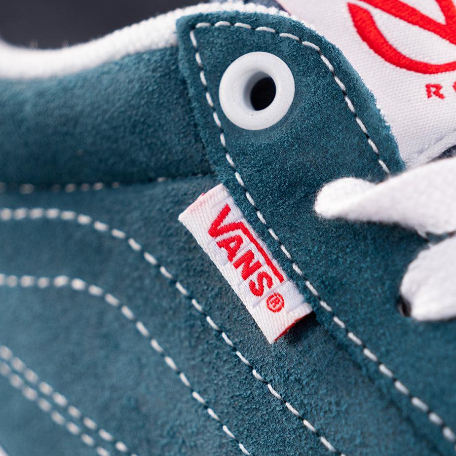 A close up of Vans Rowan Leather Shoes - Blue with a red and blue label.