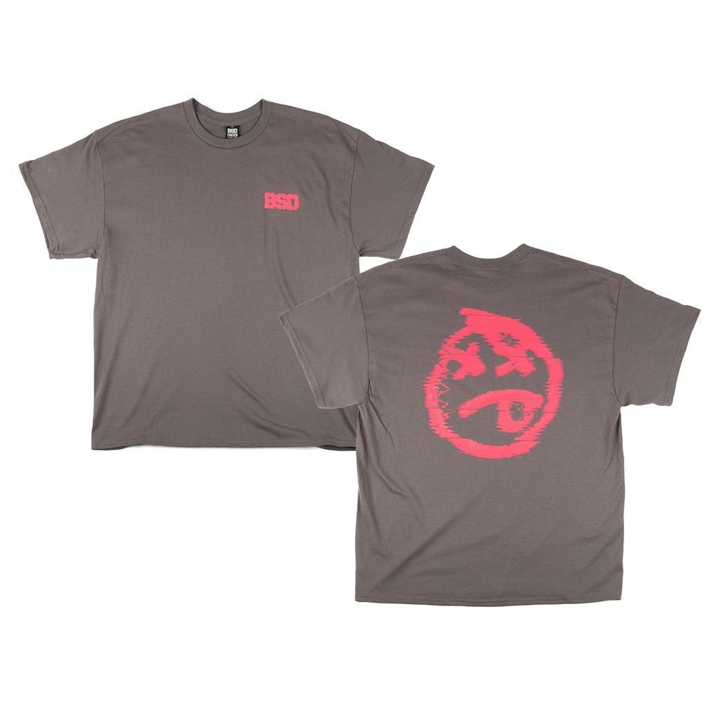 The BSD Tuned Out T-Shirt features heavyweight gray cotton, a small pink "BSD" logo on the front left chest, and a large pink distressed face graphic on the back—adding bold streetwear style to your wardrobe.