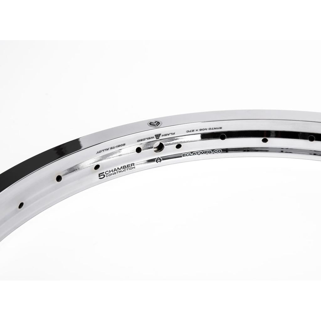 Close-up of the Eclat Temple 20 Inch Rim, a silver lightweight double-wall bike rim, set against a white background and showcasing its detailed engravings and construction.
