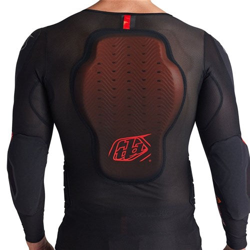 Someone seen from behind wearing the TLD 26.1 Stage Ghost D30 LS Protective Shirt Baselayer in black, featuring a large padded back protector and advanced underlayer protection system from the base layer collection.