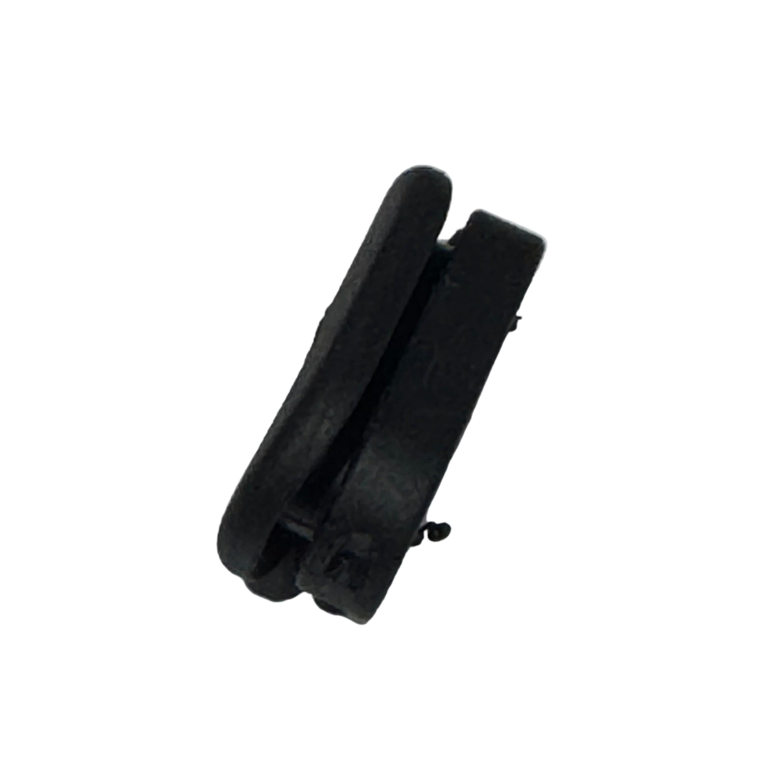 The Grommet For Internal Brake Hose Routing is a small black plastic part with two parallel sections, designed for brake hose or internal routing, shown against a white background.