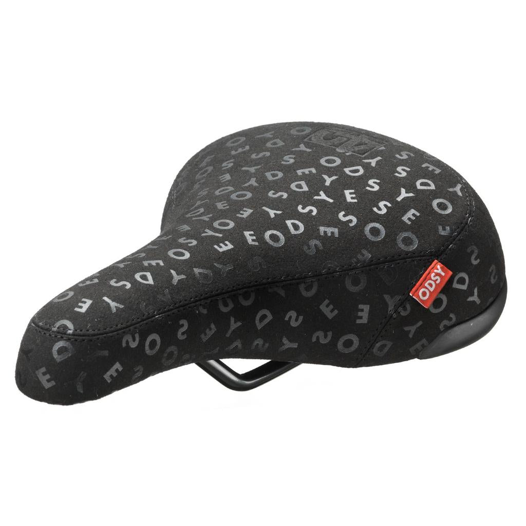 The Odyssey 40th Anniversary Railed Seat is black with scattered white letters, a small red "ODSY" tag on the side, and is released as a limited edition.